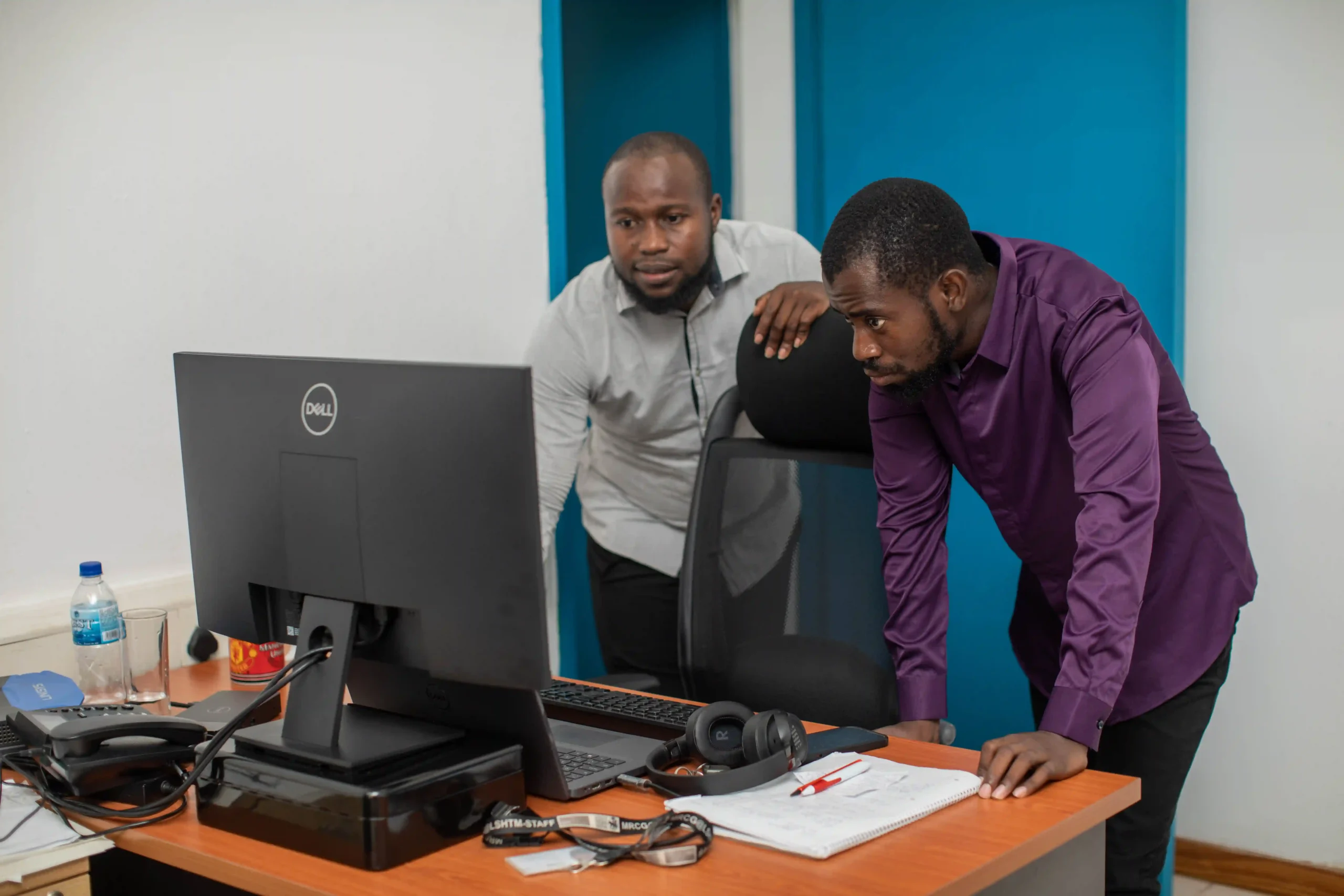 picture of two AREF staff at work